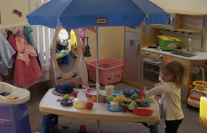 Little girl playing in the nursery at the Trinity United Methodist Church